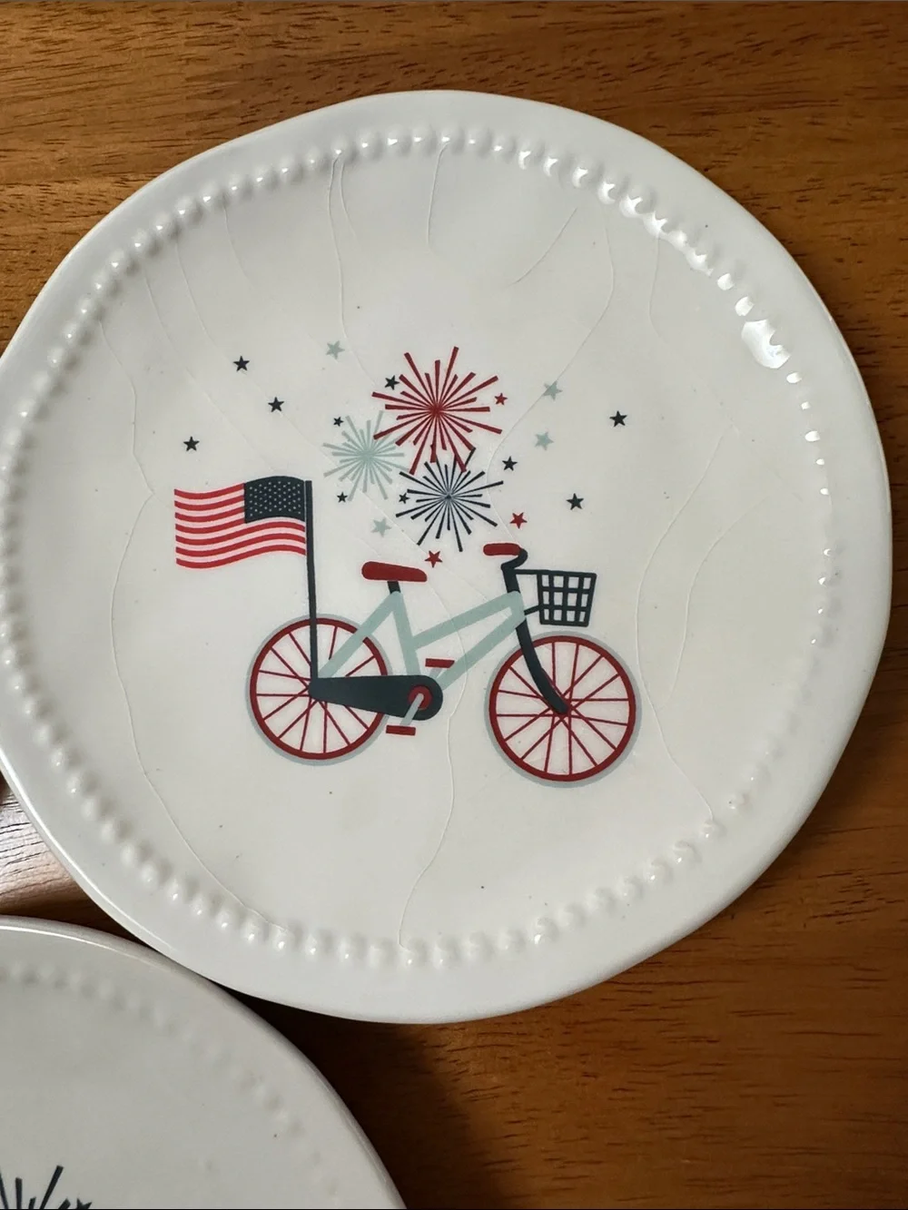 ENVOGUE home ceramic mini plate. White with patriotic bicycles. Fireworks, flags